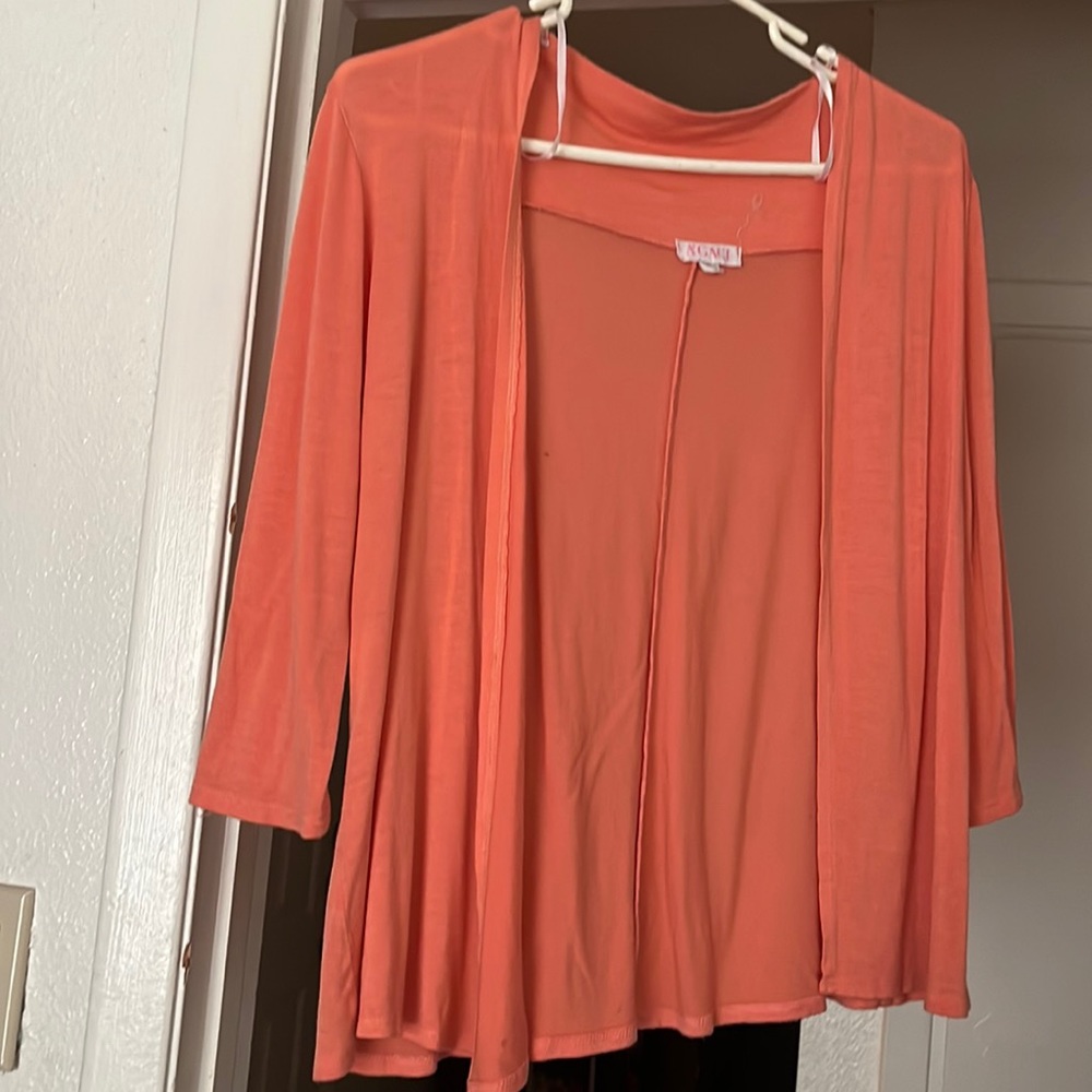 A throw on jacket type By Agaci Peach color Rayon material and small size.